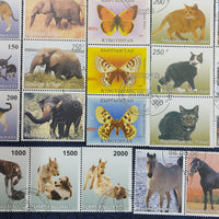 Worldwide 65 Diff. Stamp on Cat Dog Elephant Car Trains Butterflies Horse Cancelled # 7089